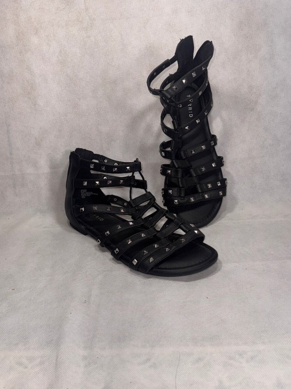 black faux-leather gladiator sandals by Torrid